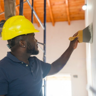 Sucmak employee on duty painting