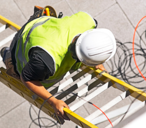 employee climbing a ladder